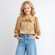 Champagne kleurige blouse met strik en pofmouwen voor meisjes